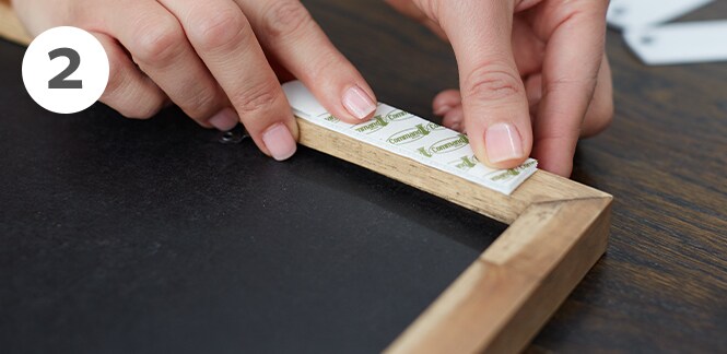 Command™ Picture Hanging Strips on the back of a picture frame
